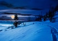 Rural footpath through snowy hillside at night Royalty Free Stock Photo