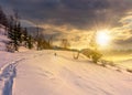 Rural footpath through snowy hillside at sunset Royalty Free Stock Photo