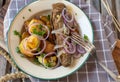 Rural german dish with fried herring and roasted potatoes