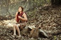 Rural girl Sitting and resting While waiting to shower in the stream In the rural areas of Thailand