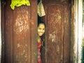 Rural girl stand in door Amroha, Uttar Pradesh, India