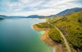 Rural highway winding along shore.