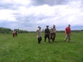 Rural holiday in Kolyvan middle ages dressed people go on the field