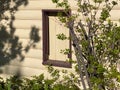 Rural house cabin house sunset dusk siding boarded window exterior design shadows log wooden lodge Royalty Free Stock Photo