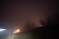 Rural house in fog at night in the mountains Royalty Free Stock Photo