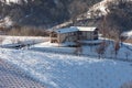 Rural house on snowy hill. Royalty Free Stock Photo