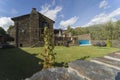 Rural house with a stone facade and a large stone patio, equipped with a swimming pool. Royalty Free Stock Photo