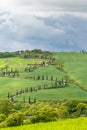 Rural idyll with a winding road on a hill