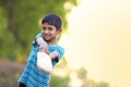 Rural Indian Child Playing Cricket