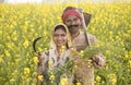 Rural Indian couple farming in agricultural field