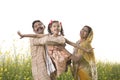 Rural Indian family having fun in agricultural field