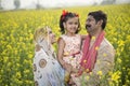 Rural happy Indian family in agricultural field Royalty Free Stock Photo