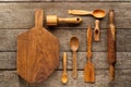 Rural kitchen utensils on vintage planked wood table from above. Rustic background with tools Royalty Free Stock Photo