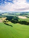 Rural landscape background with plant fields and majestic clouds