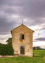 Rural landscape background on a spring afternoon under a cloudy sky that threatens storm.