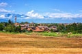 Rural landscape on a beautiful summer day, Tuscany countryside with Alps mountains and blue cloudy sky, Italy Royalty Free Stock Photo