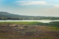 Rural landscape and cloudy sky on background.. Green hills and river