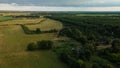 Rural landscape at dawn. Green forests and fields in the rays of the rising sun. Aerial photography Royalty Free Stock Photo