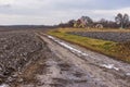 Rural landscape with an earth road leading to remote Ukrainian village Royalty Free Stock Photo