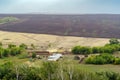 Rural landscape at the end of summer, with an agricultural farm and a plowed field Royalty Free Stock Photo