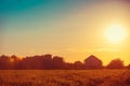 Silhouette of village against evening sky