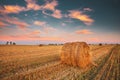 Rural Landscape Field Meadow With Hay Bales During Harvest In Sunny Evening. Sunset In Late Summer Royalty Free Stock Photo