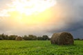 Rural Landscape Field Meadow With Hay Bales After Harvest In Sunny Evening At Sunset Or Sunrise In Late Summer. Blue Sunny Sky And Royalty Free Stock Photo
