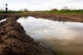 Rural landscape with green fields, soil texture, slops, beautiful sky and girl Royalty Free Stock Photo