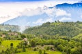 Rural landscape with green fields in the sunrise with a cloudy sky in beautiful colors Royalty Free Stock Photo