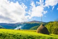 rural landscape with haystacks on the hill Royalty Free Stock Photo