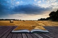 Rural landscape image of Summer sunset over field of hay bales c Royalty Free Stock Photo