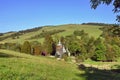 Rural landscape in Low Beskids Beskid Niski with wooden orthodox church in Chyrowa village, Poland Royalty Free Stock Photo