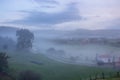 Rural landscape in the morning fog. Misty village in the morning. Autumn at countryside. Fall in the valley.