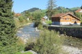 Landscape. Bend of mountain river and typical rural houses on clear summer sunny day.. Royalty Free Stock Photo