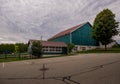 Rural landscape - old farm, green barn, field and garden, cloudy sky Royalty Free Stock Photo