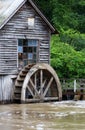 Rural landscape with old wooden watermill in woods. Royalty Free Stock Photo