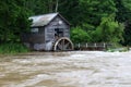 Rural landscape with old wooden watermill in woods. Royalty Free Stock Photo