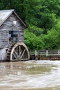 Rural landscape with old wooden watermill in woods. Royalty Free Stock Photo