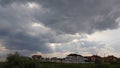 Rural landscape with overcast sky and sun rays shining Royalty Free Stock Photo