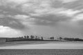 Rural landscape with plowed field and dark clouds in the Wetterau Royalty Free Stock Photo