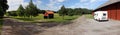 Rural landscape with a red shack and a barn in central Sweden Royalty Free Stock Photo