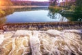 Waterfall near water mill at sunset Royalty Free Stock Photo