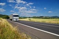 Rural landscape with road you are driving a white truck