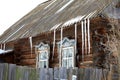 Rural landscape of Russia. Winter village with a house and forest Royalty Free Stock Photo