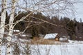 Rural landscape of Russia. Winter village with a house and forest Royalty Free Stock Photo