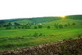 Farm Houses and Rolling Meadow at Sunset Royalty Free Stock Photo