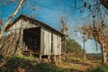 Rural landscape with a shabby shack next to trees Royalty Free Stock Photo