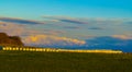 Rural landscape with straw rolls at sunset Royalty Free Stock Photo