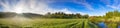 Rural landscape with sunrise,a meadow and river panorama. Royalty Free Stock Photo