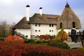 Rural landscape. Thatched roof house in autumn. Cottage in rustic style in leaf fall. Tourism in countryside. Dnipro, Ukraine